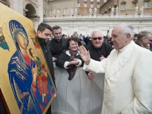Pope Francis blesses an icon of Our Lady of Perpetual Help. 