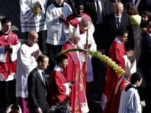 Pope Francis blesses palms during Palm Sunday Mass in St. Peter's Square April 9, 2017. 