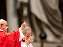 Pope Francis blesses the crowd with holy water on Pentecost Sunday May 20, 2018. 