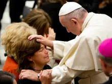 Pope Francis blesses a woman at the Dec. 5, 2018 General Audience. 