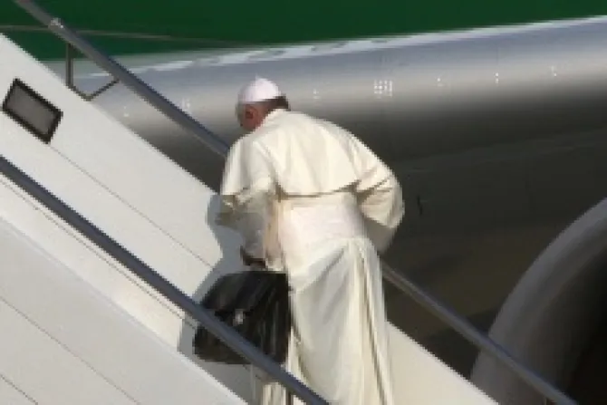 Pope Francis boards the papal plane carrying his black bag at Romes Fiumicino Airport on July 22 2013 ANSATELENEWSCNA