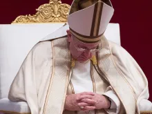 Pope Francis bowed in prayer in St. Peter's Basilica September 2015. 