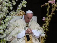 Pope Francis prays on Easter Sunday morning in St. Peter's Square on April 5, 2015. 