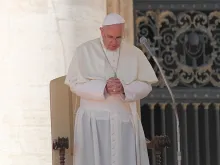 Pope Francis bows his head in prayer during a Wednesday general audience Oct. 2, 2013. 