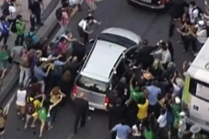 Pope Francis car is swarmed by pilgrims as he makes his way to Guanabara Palace on July 22 2013 ANSAFERMO IMMAGINE SKYCNA