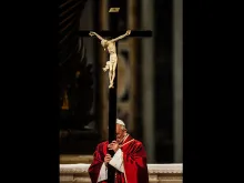 Pope Francis carries the Cross during the Good Friday Liturgy at St. Peter's Basilica, April 3, 2015. 