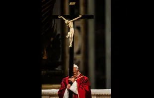 Pope Francis carries the Cross during the Good Friday Liturgy at St. Peter's Basilica, April 3, 2015.   © M. IMPROVED CPP