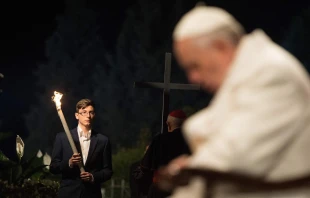 Pope Francis prays during the Stations of the Cross at the Colosseum in Rome, April 3, 2015.   L'Osservatore Romano.