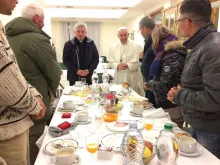 Pope Francis eats breakfast with a group of homeless Dec. 17, 2016 for his 80th birthday. 