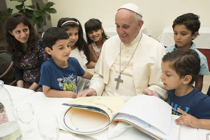 Pope Francis eats lunch with 21 Syrian refugees in the Casa Santa Marta Aug 11 2016 Credit LOsservatore Romano CNA