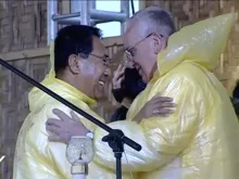 Pope Francis and Archbishop John Du embrace at a Mass in Tacloban Jan. 17. 