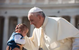 Pope Francis embraces a baby during the general audience in St. Peter's Square on August 26, 2015.   L'Osservatore Romano.