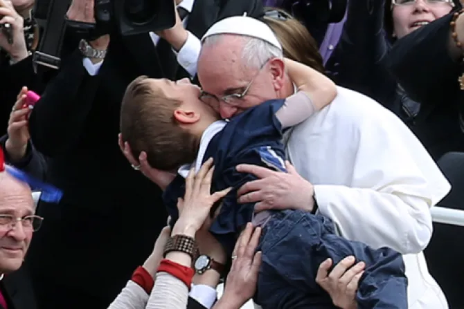 Pope Francis embraces a boy prior to his first Urbi et Orbi blessing on Easter Sunday March 31 2013 Credit Franco Origlia Getty Images News Getty Images CNA 4 3 13