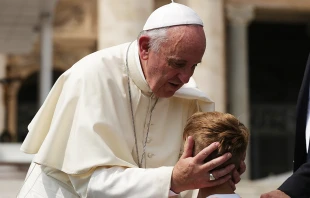 Pope Francis embraces a child at the general audience in St. Peter's square on Sept. 2, 2015.   Daniel Ibáñez/CNA.