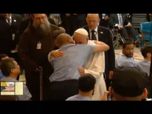 Pope Francis embraces a man at Curran-Fromhold Correction Facility in Philadelphia Sept. 27, 2015. 