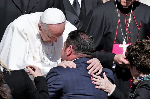 Pope Francis embraces a man at the Wednesday General Audience March 29, 2017. ?w=200&h=150
