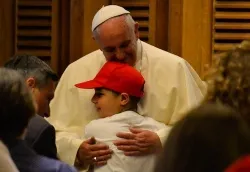 Pope Francis embraces a young student on May 31, 2014 in Paul VI audience hall. ?w=200&h=150