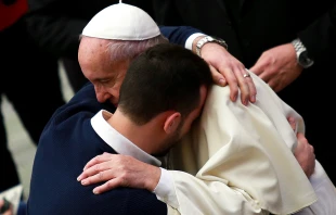 Pope Francis embraces a pilgrim during the General Audience at the Vatican's Paul VI Hall, Jan. 13, 2016.   Daniel Ibanez/CNA.