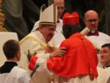 Pope Francis embraces a new cardinal at the Feb. 22 consistory, February 22, 2014. 