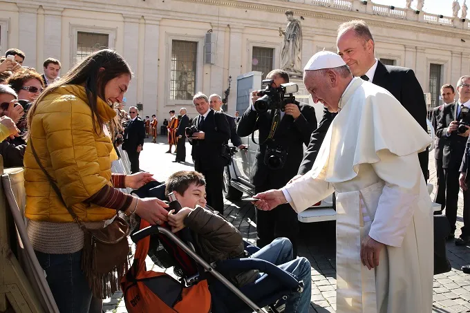 Pope Francis gives a rosary to a disabled child during his general audience Feb. 24, 2016. ?w=200&h=150