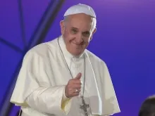 Pope Francis gives a thumbs up to youth on July 25, 2013. 