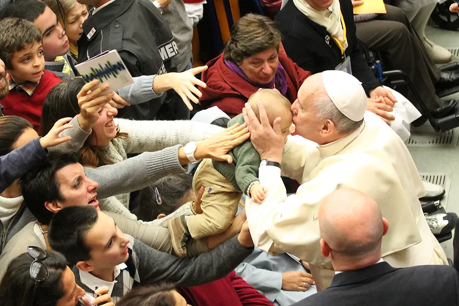 Pope Francis kisses a baby at a Pontifical Council for Health Care conference on autism Nov. 22, 2014. ?w=200&h=150