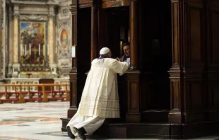 Pope Francis goes to Confession during a penitential celebration at St. Peter's Basilica, March 28, 2014.   Ansa/L'Osservatore Romano.