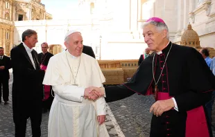 Pope Francis greets Archbishop Edoardo Menichelli of Ancona-Osimo, who will be made a cardinal Feb. 14, at the Vatican on Jan. 4, 2015.   ANSA.