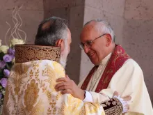 Pope Francis greets Catholicos Karekin II during divine liturgy, June 26, 2016. 