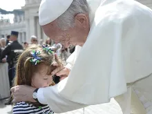 Pope Francis greets Lizzy Myers in St. Peter's Square on April 6, 2016. 