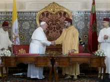 Pope Francis greets Moroccan King Mohammed VI in Rabat March 30, 2019. 