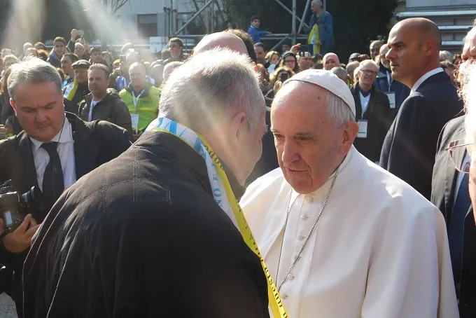 Pope Francis greets a local priest during his visit to the ?w=200&h=150
