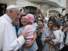 Pope Francis greets a mother and daughter during a special meeting with sick children in New York City, Sept. 25, 2015. 