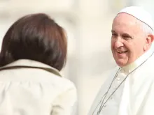 Pope Francis greets a woman Oct. 1, 2014. 