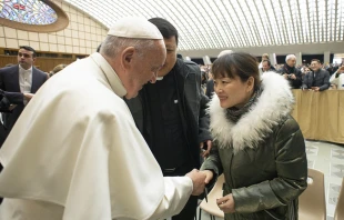 Pope Francis greets a woman after the general audience Jan. 8, 2020.   Vatican Media.