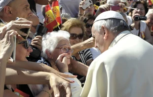 Pope Francis greets an elderly woman at the Wednesday general audience in St. Peter's Square on June 3, 2015.