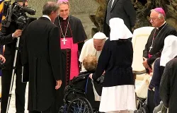 Pope Francis greets an elderly woman in a wheelchair Nov. 23, 2013. ?w=200&h=150