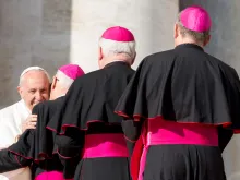 Pope Francis greets bishops. 