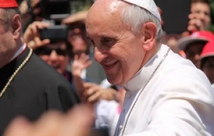 Pope Francis greets children as they arrive in Vatican City aboard a train during the Journey of Beauty event June 23, 2013.   Alan Holdren/CNA.