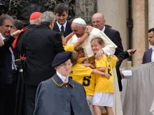 Pope Francis greets children during his General Audience June 25, 2014. 