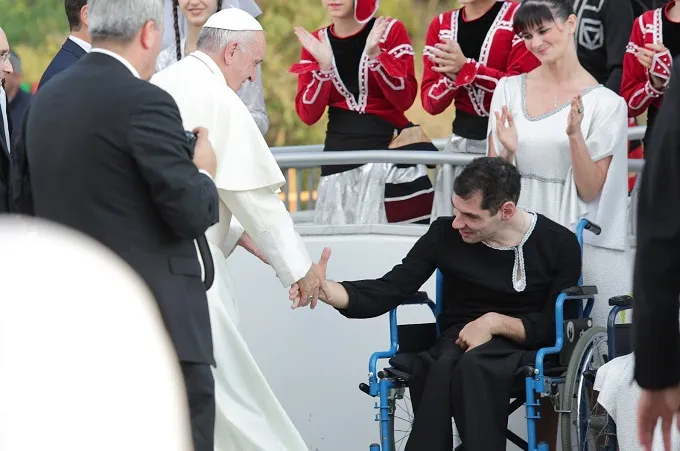 Pope Francis greets disabled people outside the Assistance Center of St. Camillius in Georgia Oct. 1, 2016. ?w=200&h=150