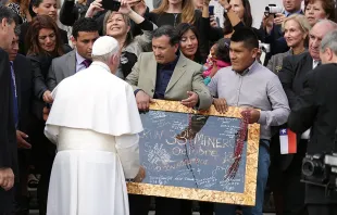 Pope Francis is presented with the signatures of the 33 miners who were rescued in 2010 from Copiapó mine, at the General Audience in St. Peter's Square, Oct. 14, 2015.   Daniel Ibanez/CNA. 