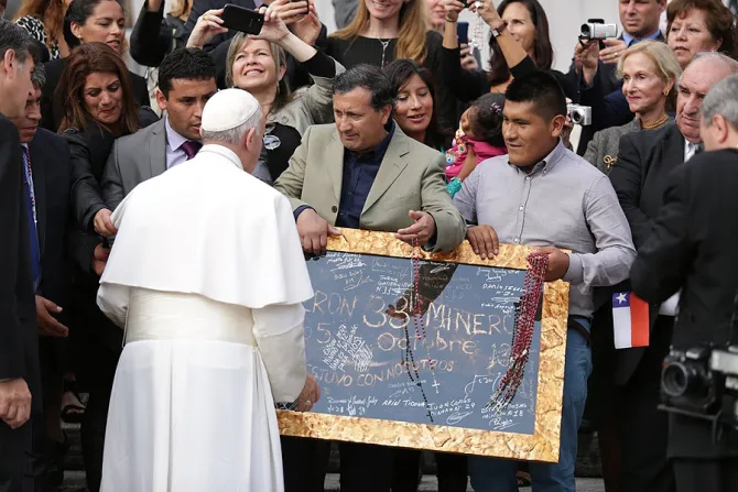 Pope Francis greets men from Chile with signatures of miners to St Peters Square during the general audience on Oct 14 2015 Credit Daniel Ibanez CNA 10 14 15