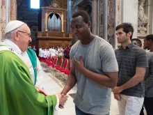 Pope Francis greets migrants July 6, 2018 after Mass for the anniversary of his visit to Lampedusa. 