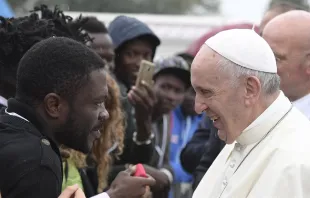 Pope Francis greets migrants at a welcome center near Cesena, Italy, Oct. 1, 2017.   Vatican Media.
