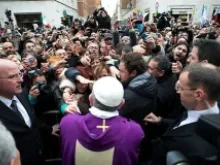 Pope Francis greets people after celebrating Mass at St. Anne's parish on March 17, 2013. 