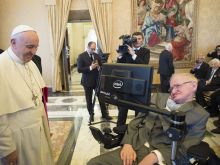 Pope Francis greets physicist Stephen Hawking in Vatican City. 
