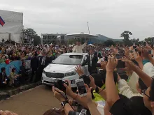 Pope Francis greets pilgrims as he arrives for the closing Mass of the 6th Asian Youth Day Aug. 17, 2014. 