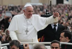 Pope Francis greets pilgrims as he rides through St. Peters Square during his General Audience on Nov. 25, 2013 ?w=200&h=150