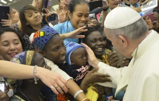 Pope Francis greets pilgrims before the General Audience in the Vatican's Paul VI Hall, Aug. 19, 2015.   L'Osservatore Romano.